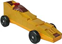 Yellow pinewood derby car made of legos